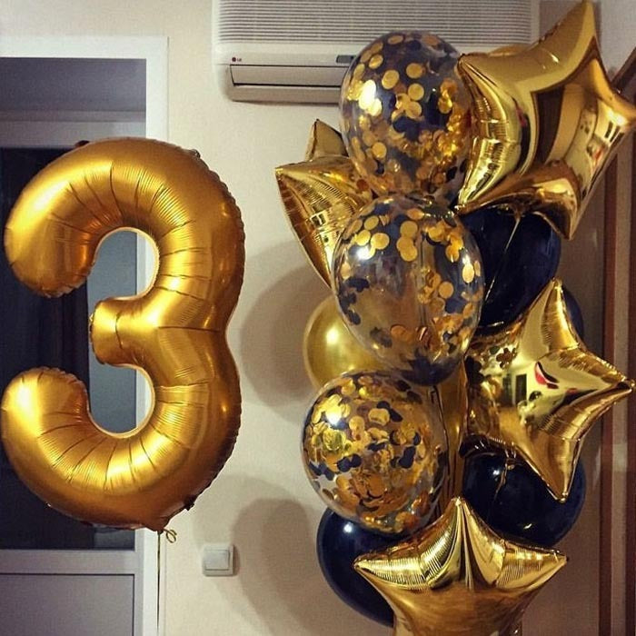Set: 1 goldene Zahl (100 cm), 3 goldene Konfetti-Ballons, 4 goldene Foliensterne und 10 Latexballons (Schwarz und Gold)
